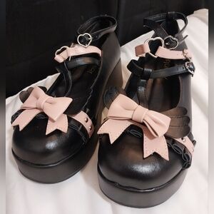 Pink and black bow shoes